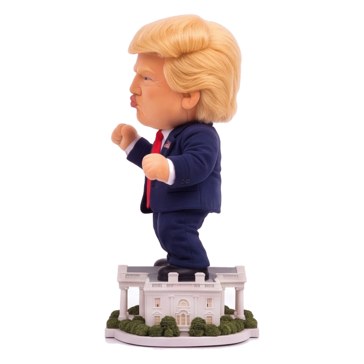 Talking Trump desk toy, side view showing puckered lips and plush suit