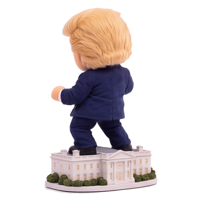 Talking Trump desk toy, back angle view of hair and White House base
